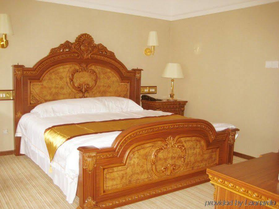 Golden Zone Hotel Jinghong Chambre photo